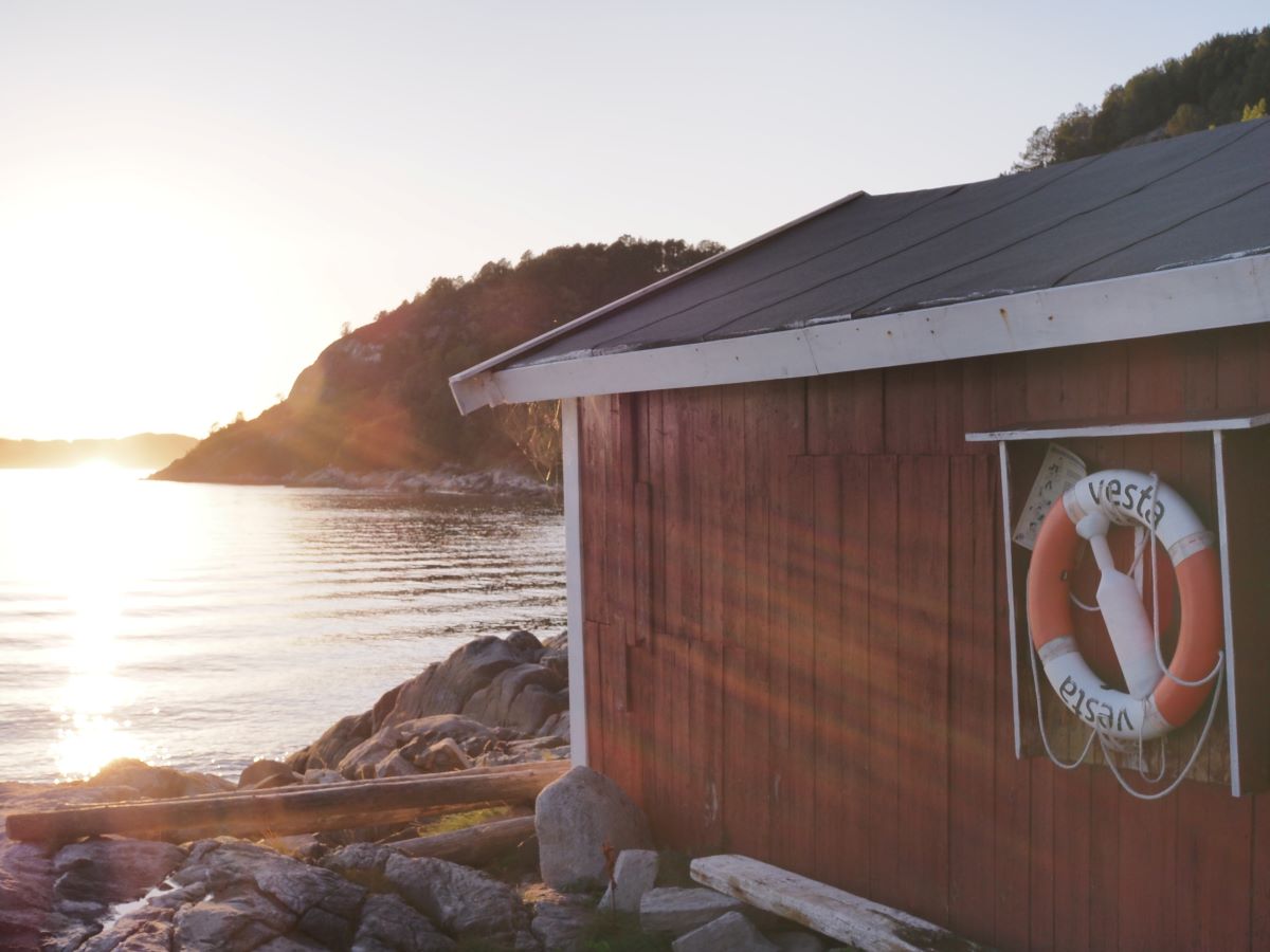 Red boat house on the Bremsnesfjord, close to Kristiansund.